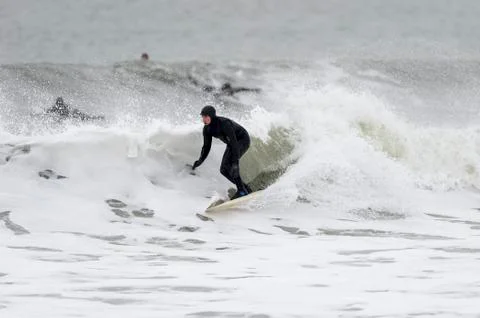 Surfer on foamy wave Stock Photos
