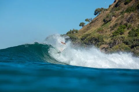 Surfer gets lost in breaking wave Stock Photos