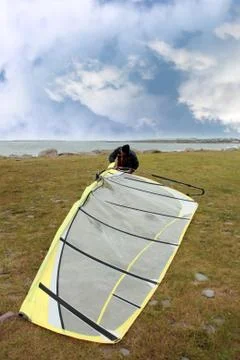 Surfer getting board ready to windsurf Stock Photos