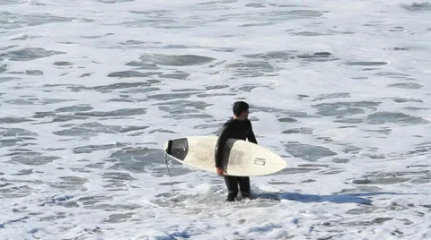 Surfer getting out of the water Stock Footage 36667887