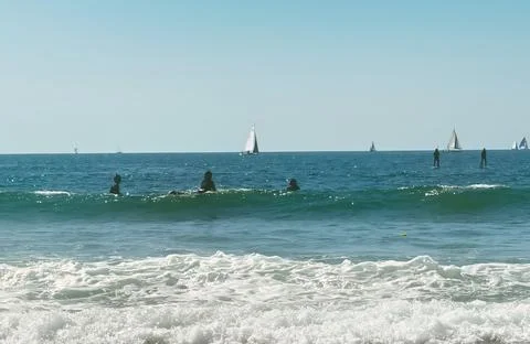 Surfer getting ready to catch a wave Stock Photos