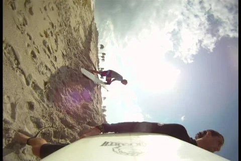 Surfer Going Out Stock Footage