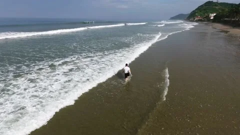 Surfer going waiting at the shore Stock Footage 145147456