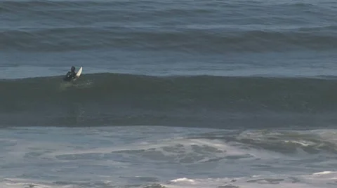 Surfer grabs a wave and falls Stock Footage 8624616