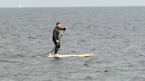 Surfer on a Grey Day Stock Footage 46034434