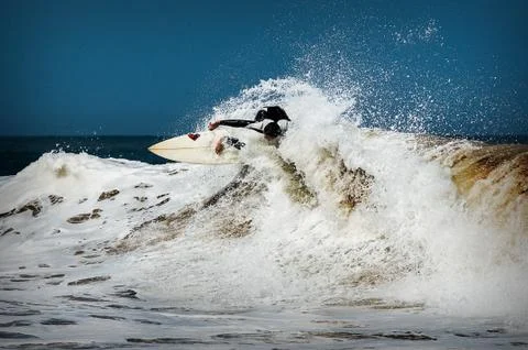 Surfer guy in the Morocco waves Stock Photos