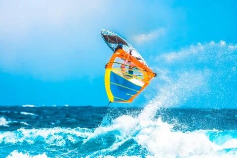 A surfer jumping on the wave Stock Photos