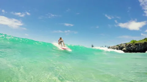 Surfer on Longboard Rides By the Camera with his Arms Extended for Balance an Stock Footage 52712164