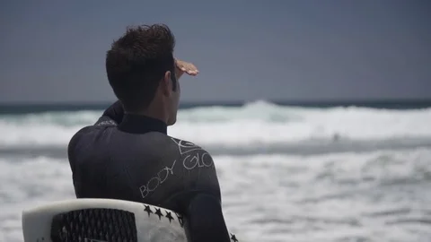 Surfer looking at the Waves 3 Stock Footage 83057163