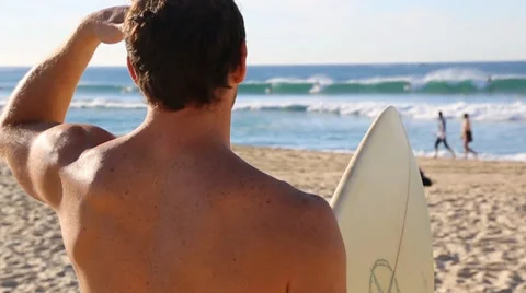 Surfer looking at waves 50fps Stock Footage 34262065