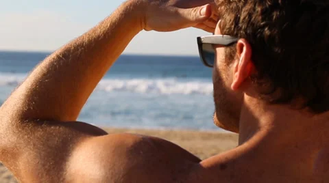 Surfer looking at waves in slow-mo Stock Footage 34332691