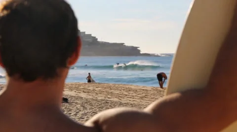 Surfer looking at waves slow motion Stock Footage 34332683