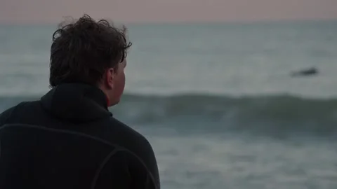 Surfer looks at big waves and surfer in Lake Michigan at Bradford beach Video stock 166254180