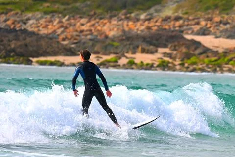 Surfer man in dynamic action off Ferrol, Spain (1) Stock Photos