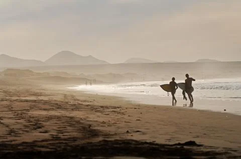 Surfer in the morning light Stock Photos