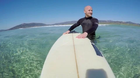 The surfer in the ocean Stock Footage
