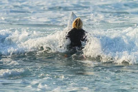 Surfer Paddle Out Stock Photos