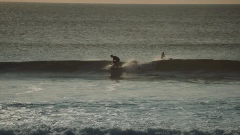 Surfer with paddle riding the ocean wave. Stock Footage 285738819