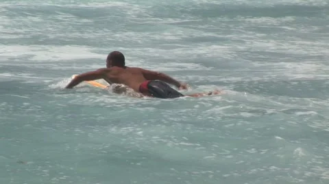 Surfer Paddles Out Stock Footage 5243387