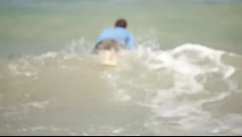 Surfer Paddles Out 스톡 동영상 6923721
