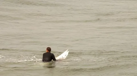 Surfer paddling board Stock Footage 21979917
