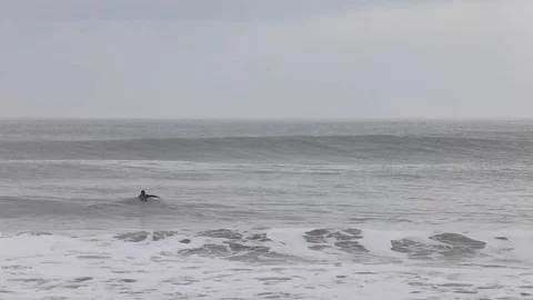 Surfer paddling Stock Footage 127524797