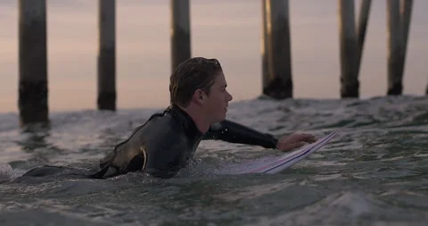 Surfer Paddling at Pier Stock Footage 262088902