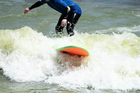 Surfer Paddling Through Artificial Wave Pool 스톡 사진