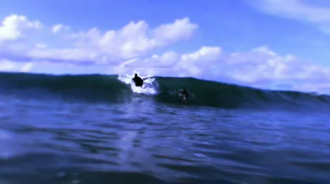 Surfer passing slow motion Stock Footage 671031