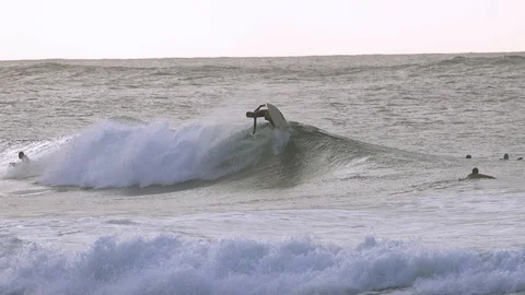 Surfer performing a stunt on big ocean waves in slow motion Stock Footage 85818854