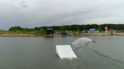 Surfer performs tricks and swims to shore Video stock 93662444