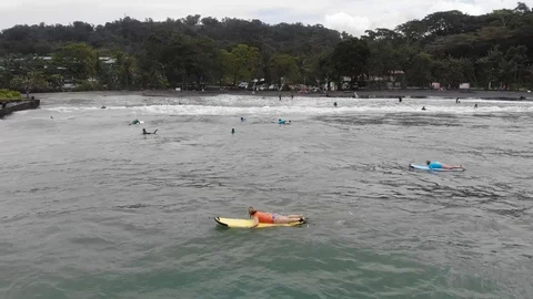 Surfer at playa negra Stock Footage 127256161