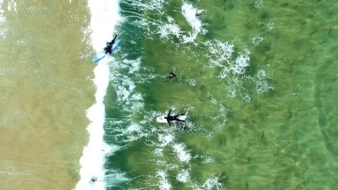 Surfer pulling away from group of surfers Stock Footage 99761578