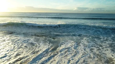 Surfer returns to beach Stock Footage 107073325