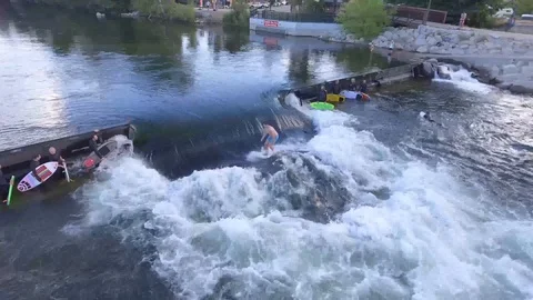 Surfer Rides River Wave 4K Aerial Stock Footage 100090237