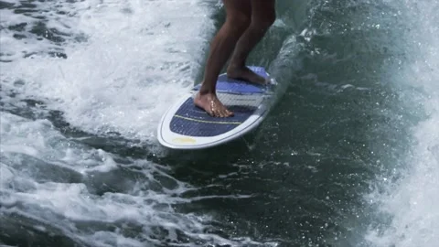 Surfer rides on a surfboard on a wave Stock Footage 131956826