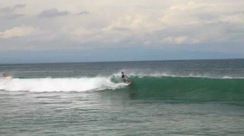 Surfer rides wave and pulls air Video stock 44400217