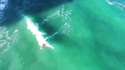 Surfer rides wave in Florida, view from above Stock Footage 73795370
