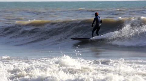 Surfer Rides a Wave Stock Footage 63561450