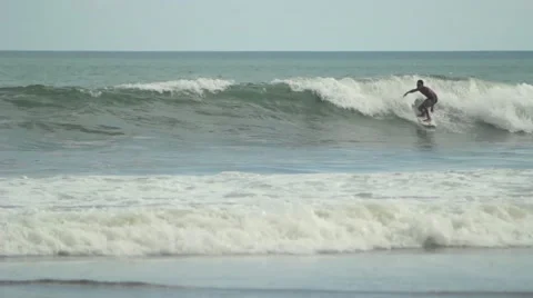 Surfer Rides on a Wave Stock Footage 67532840