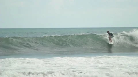 Surfer Rides on a Wave Stock Footage 67533424