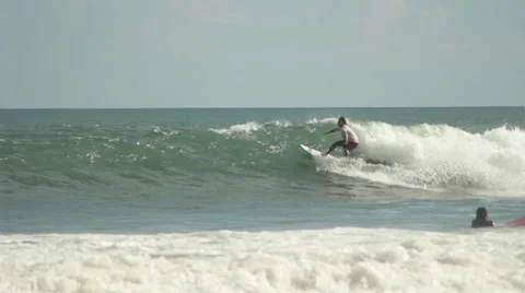 Surfer Rides on a Wave Stock Footage 67533534