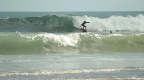Surfer Rides on a Wave Stock Footage 67533573