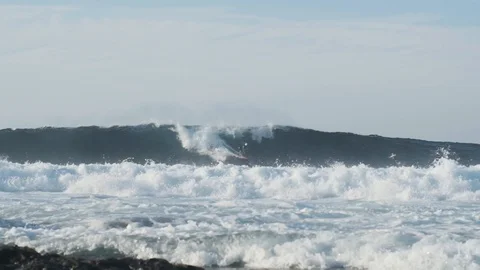 Surfer Rides a Wave Stock Footage 101860988