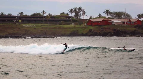 Surfer rides the waves, Easter Island Stock Footage 64872456
