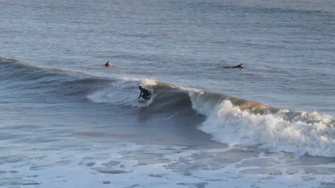 Surfer riding 4 foot wave, Isle of Wight, UK Stock Footage 238595026