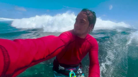 Surfer riding and turning with spray on blue ocean wave, surfing ocean lifestyle Stock Footage 167349803