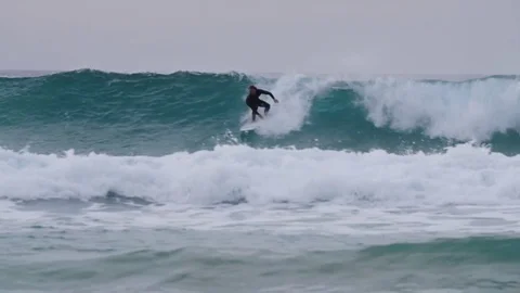 Surfer riding a big wave Stock Footage 71540774
