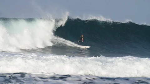 Surfer riding a big wave Stock Footage 71546635