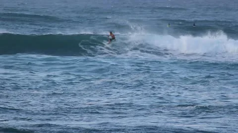 Surfer riding catching a wave Stock Footage 14808951